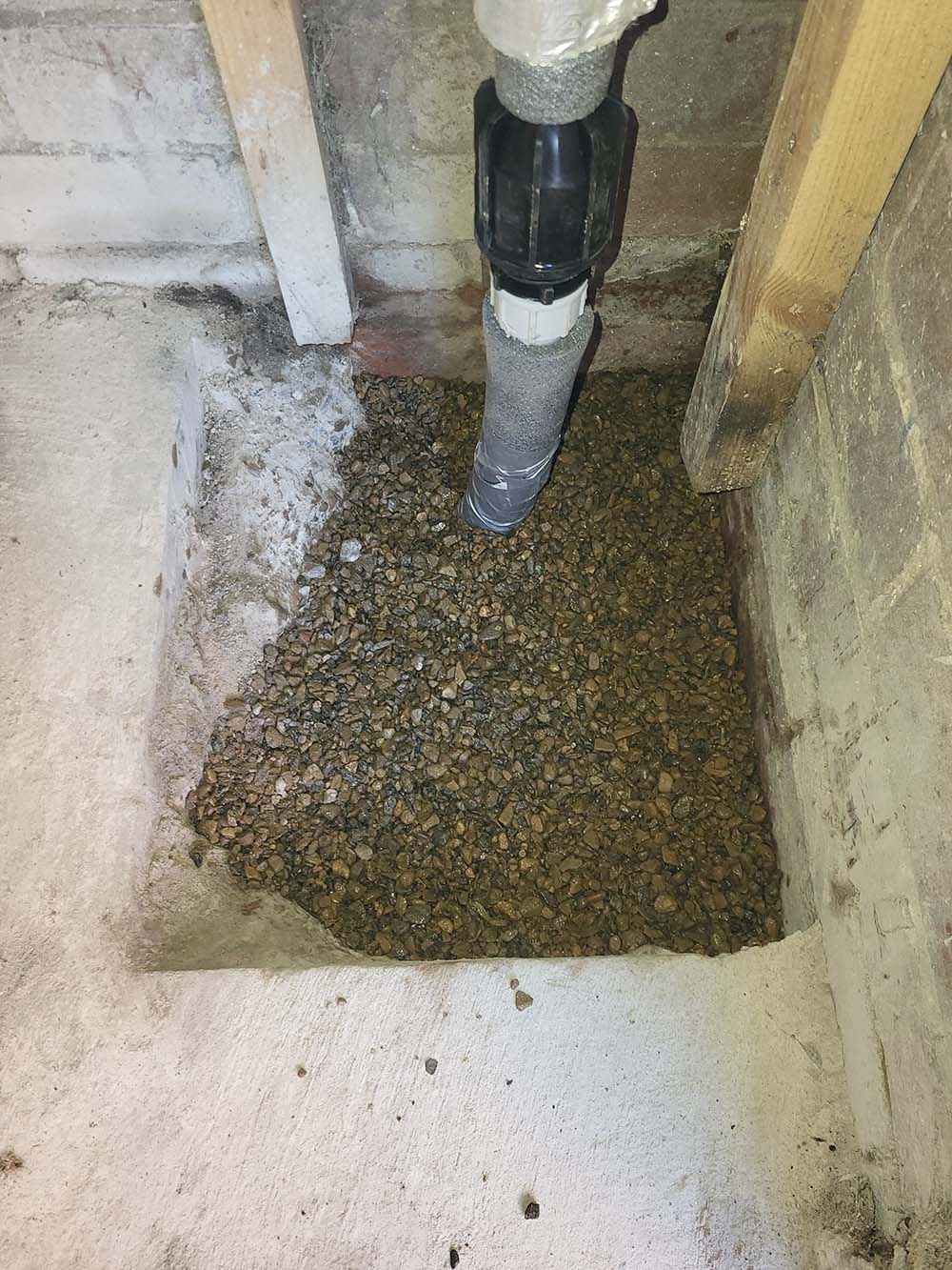 Water pipe hole filled in with stone